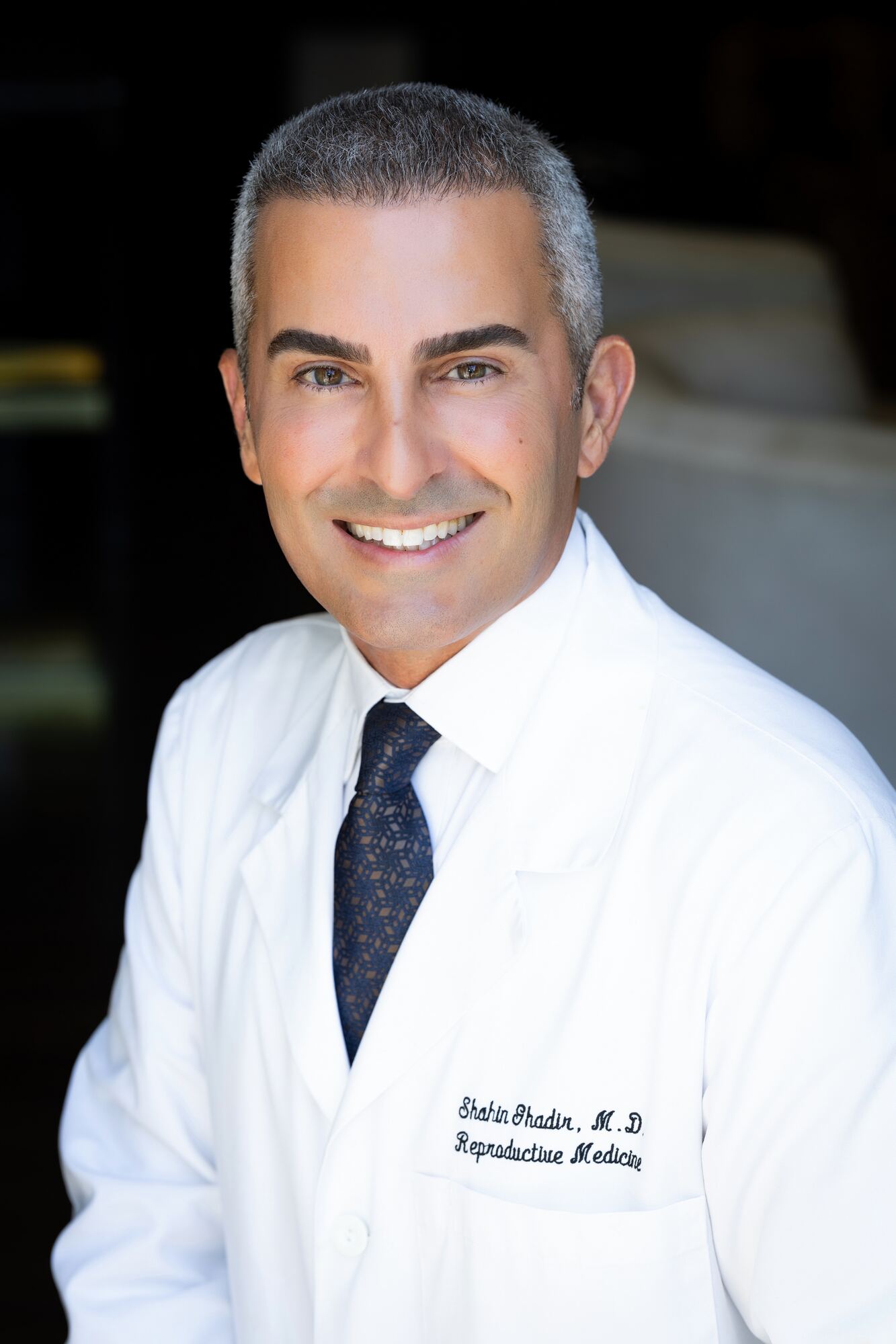 Dr. Shahin Ghadir standing at the practice entrance